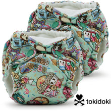 Load image into Gallery viewer, Lil Joey Newborn and preemie AIO cloth Diaper by Kanga Care in tokiTreats tokidoki with a colorful cartoon character print featuring Donutella Mozarella on a mint green background, shown on a white background with the Tokidoki logo in the bottom right corner.