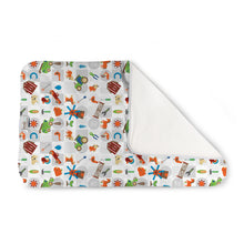 Load image into Gallery viewer, Kanga Care Changing Pad and Sheet Saver in the print called Harvest with a colorful cartoon farm pattern on a white background, shown with one corner folded over to reveal a solid white reverse side.