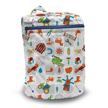 Load image into Gallery viewer, Kanga Care Wet Bag for cloth diapers in print Harvest featuring a colorful cartoon-style farm-themed pattern with illustrations of tractors, a windmill, a horseshoe, a plow, a watering can, and other rural icons on a light gray background.