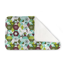 Load image into Gallery viewer, Kanga Care Changing Pad and Sheet Saver in the print called Frolic with a colorful geometric winter pattern, showing a white sherpa backing on a clean white background.