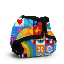 Load image into Gallery viewer, Rumparooz Newborn Cloth Diaper Cover by Kanga Care in the print called Resolution with a vibrant, multicolor retro geometric pattern featuring squares, hearts, and stripes in blue, red, yellow, green, and orange, accented by black elastic straps and red snap buttons, shown on a white background.