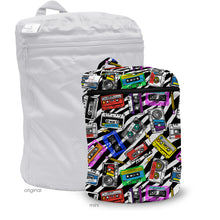 Load image into Gallery viewer, Kanga Care Wet Bag Mini for cloth diapers in the print Mixtape with a colorful cassette tape pattern on a black and white striped background, shown next to a large white zippered storage bag labeled 'original'.