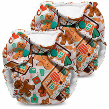 Load image into Gallery viewer, Lil Joey Newborn and preemie AIO cloth Diaper by Kanga Care in Bake Time with a festive gingerbread print, featuring gingerbread men, houses, candy canes, and snow globes on a white background.