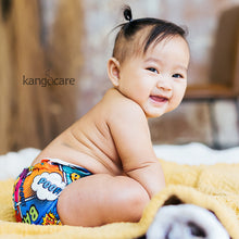 Load image into Gallery viewer, Baby sitting on a blanket wearing a Bam print Rumparooz
