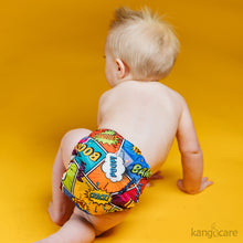 Load image into Gallery viewer, toddler crawling away wearing a Bam Rumparooz against a mustard yellow background

