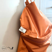 Load image into Gallery viewer, Kanga Care Cloth Diaper Wet Bag Copper Orange Hanging