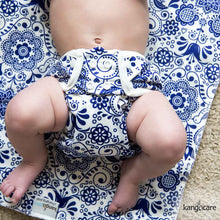 Load image into Gallery viewer, Baby in an Elskede cover laying on an Elskede Changing Pad