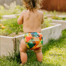 Load image into Gallery viewer, Finn Rumparooz One Size Cloth Diaper on a baby playing outdoors
