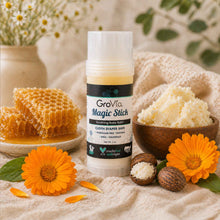 Load image into Gallery viewer, GroVia Magic Stick with natural elements like flowers and honeycomb on a soft fabric background