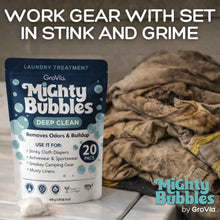 Load image into Gallery viewer, Mighty Bubbles laundry treatment packaging with dirty clothes in the background