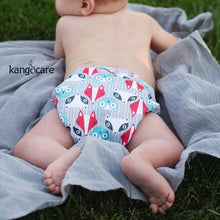 Load image into Gallery viewer, Rumparooz One Size Cloth Pocket Diaper Clyde laying on a blanket in the grass