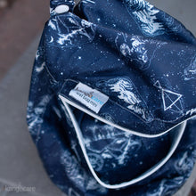 Load image into Gallery viewer, Shine Bright Wet Bag Mini sitting open with Shine Bright product inside