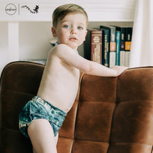 Load image into Gallery viewer, Toddler in Rumparooz G3 One Size Pocket Diaper in the deep teal and pine green print Stargazing