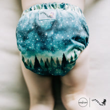Load image into Gallery viewer, Toddler in Rumparooz G3 One Size Pocket Diaper in the deep teal and pine green print Stargazing