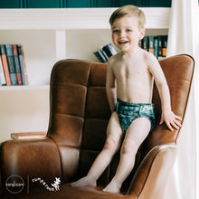 Load image into Gallery viewer, Toddler in Rumparooz G3 One Size Pocket Diaper in the deep teal and pine green print Stargazing
