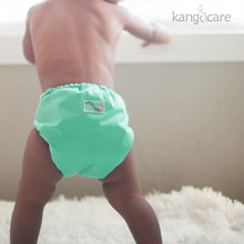Load image into Gallery viewer, Sweet and Scuba Rumparooz One Size Pocket Cloth Diaper on a standing toddler, size medium