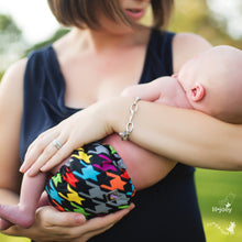 Load image into Gallery viewer, Parent cradling newborn wearing an Invader Lil Joey