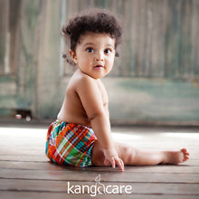 Load image into Gallery viewer, Baby sitting looking at the camera, wearing Quinn Rumparooz One Size Pocket Cloth Diaper
