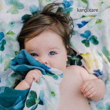 Load image into Gallery viewer, Baby laying on a Clover blanket