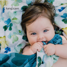 Load image into Gallery viewer, Baby laying on a Clover blanket