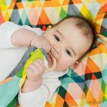 Load image into Gallery viewer, Baby laying on a Finn serene blanket, chewing on a Finn blanket teether

