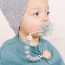 Load image into Gallery viewer, Baby with Graphite Paci Clip attached to their top and soother, zoomed in 
