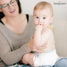 Load image into Gallery viewer, Baby sitting, wearing a Kanga Care Prefold 
