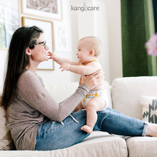 Load image into Gallery viewer, Baby sitting on mom in a Kanga Care Prefold