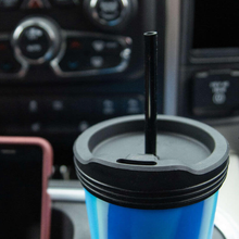 Load image into Gallery viewer, Arctic Swirl SiliPint with black lid and straw in a car 

