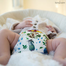 Load image into Gallery viewer, Sunshower Rumparooz One Size Cloth Diaper on a sleeping baby in a basket
