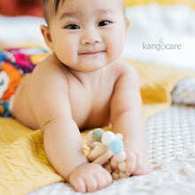 Load image into Gallery viewer, Baby in a Bam Rumparooz holding a Moss Teething Ring