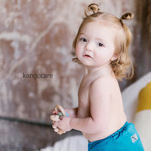 Load image into Gallery viewer, Baby in a Caribbean Rumparooz holding a Moss Teething Ring