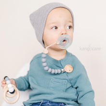 Load image into Gallery viewer, Baby with Graphite Paci Clip attached to their top and soother