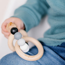 Load image into Gallery viewer, Baby holding a Pebble Teething Ring