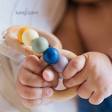 Load image into Gallery viewer, Rainbow Teething ring in a baby's hands