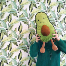 Load image into Gallery viewer, Child holdiing Jellycat Amuseable Avocado 
