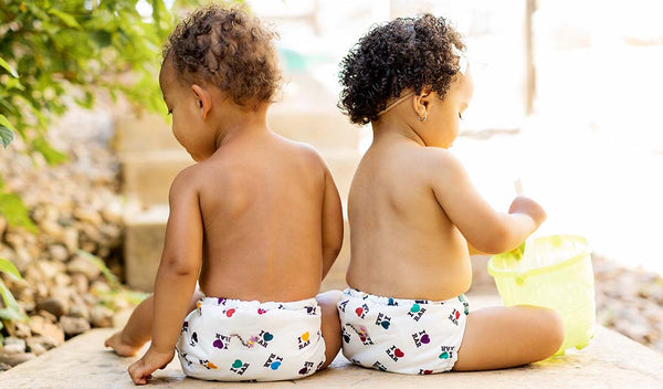 Two babies in I Love RAR Rumparooz
