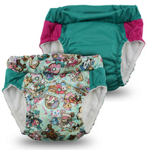 Load image into Gallery viewer, Two children's swim diapers and training pants, one with a cartoon pattern and the other solid teal, on a white background.
