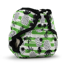Load image into Gallery viewer, Rumparooz One Size Cloth Diaper Cover in the print Spike with a green and white striped pattern, decorated with black line-art pineapples. It features black adjustable straps and snap closures, photographed on a clean white background.
