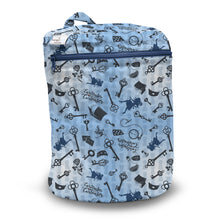 Load image into Gallery viewer, Kanga Care Wet Bag for cloth diapers in print Alice with a light blue background and a dark blue pattern of keys, locks, and magical words like 'Alohomica' and 'Leverkeeper'.
