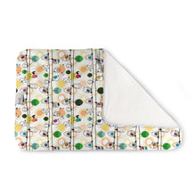 Load image into Gallery viewer, Kanga Care Changing Pad and Sheet Saver in the print called Tweet with a colorful cartoon sheep pattern on a cream background, folded to show a solid white reverse side, photographed on a clean white background.
