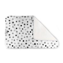 Load image into Gallery viewer, Kanga Care Changing Pad and Sheet Saver in the print called Splotch with a white background and a pattern of black, gray, and white watercolor-style polka dots, shown with one corner folded over to reveal a solid white reverse side.

