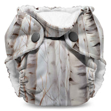 Load image into Gallery viewer, Lil Joey preemie &amp; newborn AIO cloth diaper by Kanga Care Christmas print called Aspenglow with aspen trees during fall on a white background
