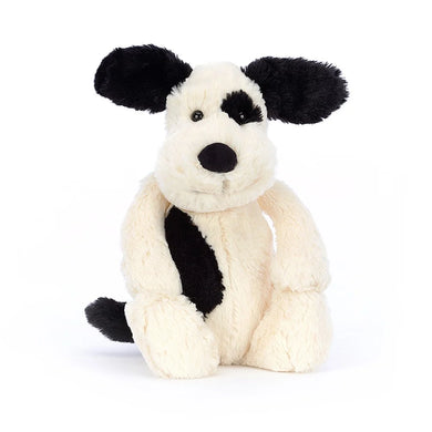 Bashful Black & Cream Puppy seated front view