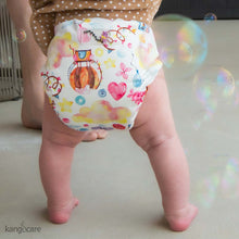 Load image into Gallery viewer, Candylicious Rumparooz One Size Pocket Cloth Diaper on a standing baby
