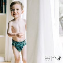 Load image into Gallery viewer, Toddler in Rumparooz G3 One Size Pocket Diaper in the deep teal and pine green print Stargazing
