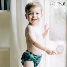 Load image into Gallery viewer, Toddler in Rumparooz G3 One Size Pocket Diaper in the deep teal and pine green print Stargazing
