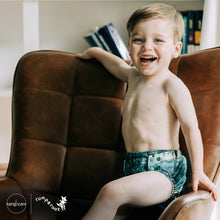 Load image into Gallery viewer, Toddler in Rumparooz G3 One Size Pocket Diaper in the deep teal and pine green print Stargazing
