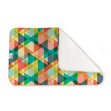 Load image into Gallery viewer, Finn Changing Pad - triangle geometric print in yellow, greens, blue, and orange
