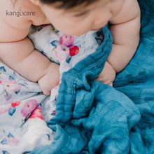 Load image into Gallery viewer, Baby laying on a Lily Baby blanket
